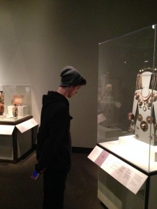 Logan Torve investigating the artifacts from Mycenaean period at the Chicago Field Museum.
